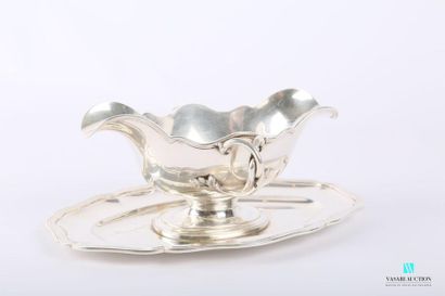 null Silver gravy boat and its frame, the border with scrolled contours hemmed with...