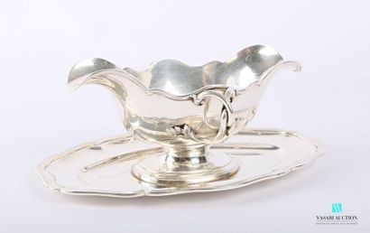 null Silver gravy boat and its frame, the border with scrolled contours hemmed with...