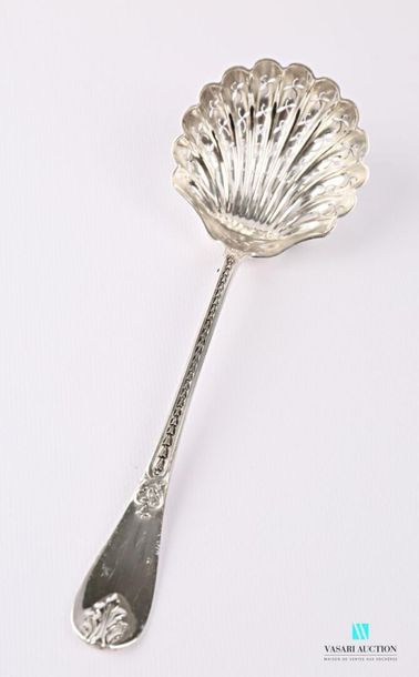 null Silver sprinkling spoon, the handle underlined by a fall of asparagus tips is...
