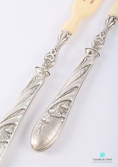 null Salad servers, silver handles filled with a decoration of leafy and flowery...