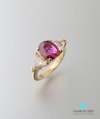 null 750 thousandths yellow gold ring set in the center of a ruby shouldered with...