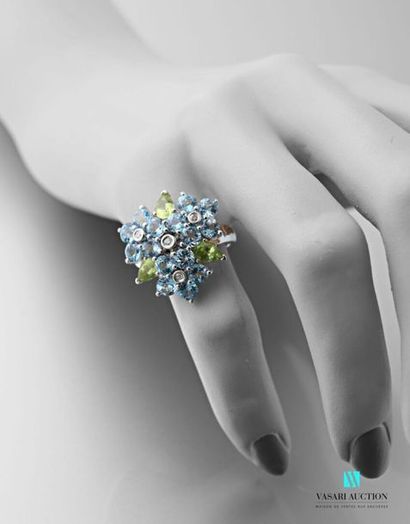 null 750 thousandths white gold flower ring adorned with four flowers set with round-cut...