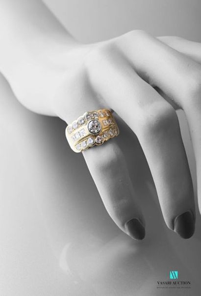 null 750 thousandths yellow gold band ring set with three rows of diamonds: two of...