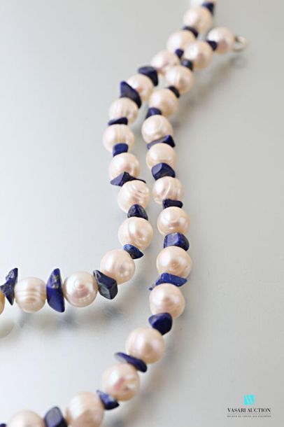 null Choker necklace made of fresh water pearls alternating with lapis lazuli bars,...