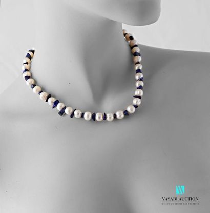 null Choker necklace made of fresh water pearls alternating with lapis lazuli bars,...