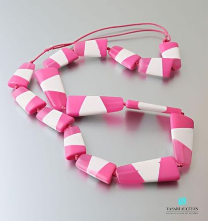 null Long necklace with pink and white plastic free designs on a cord.
Length: 47...