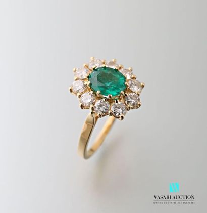 null 750 thousandths yellow gold pompadour ring set with a central emerald set with...