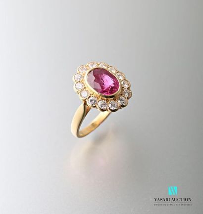null Pompadour ring in 750 thousandths yellow gold set with a central ruby surrounded...