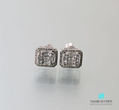 null Pair of 750 thousandths white gold earrings set with baguette-cut diamonds in...