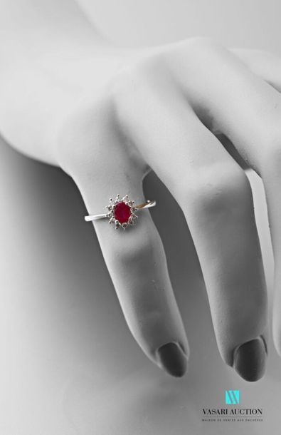 null Ring in 750 thousandths gold girs set with a ruby of about 0.45 carats hemmed...