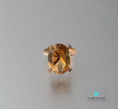 null 750 thousandths yellow gold ring set with a pretty oval citrine punctuated with...