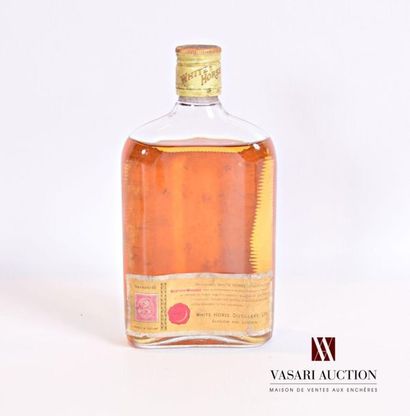 null 1 flaskScotch Whisky WHIRTE HORSE
37.5 cl - 43°. And. a little faded and stained...