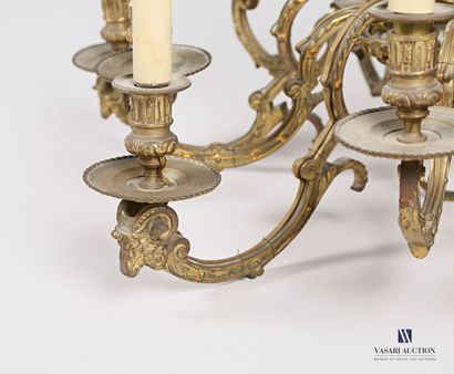 null Bronze chandelier with twelve lights, the shaft has a sphere decorated with...