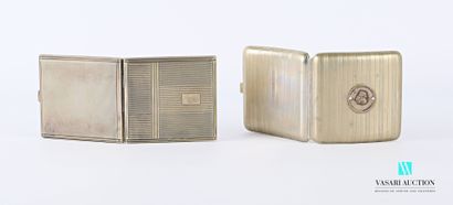 null Set of two hinged cigarette cases comprising : 

-A metal cigarette case decorated...