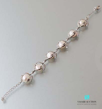 null Metal bracelet adorned with six freshwater cultured pearls, the clasp snap hook.

Length:...