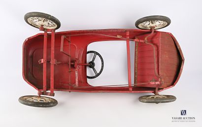 null A child's pedal car made of red painted sheet metal, bearing the number 3, it...