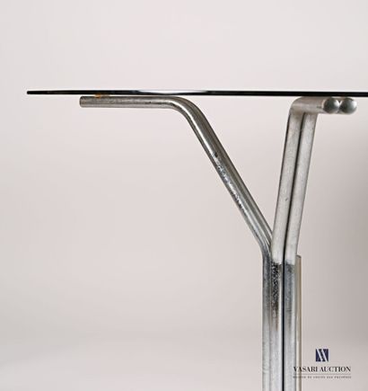 null Dining room table, the oblong smoked glass top rests on two chromed tubular...