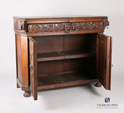 null Moulded and carved oak sideboard with a drawer with a central lion's head decoration...