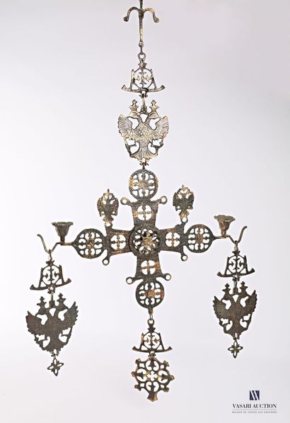 null A gilded and moiré patinated metal candlestick with an openwork cross surmounted...