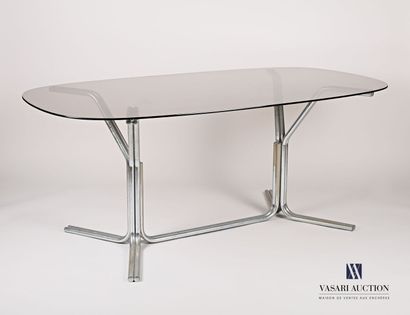 null Dining room table, the oblong smoked glass top rests on two chromed tubular...