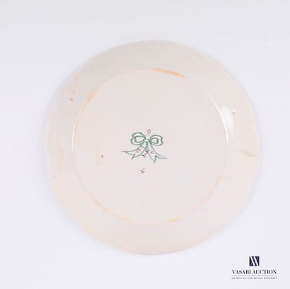 null Revolutionary white earthenware plate with polychrome decoration in the basin...