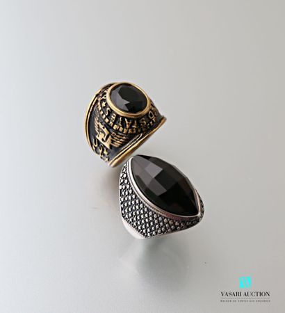 null Set of two rings, one in steel and facetted onyx, the other United State Navy...