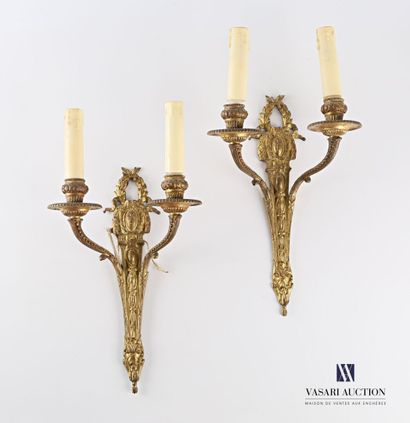 null Pair of gilt bronze two-light sconces, the shaft has a frieze of tapering mandorles...
