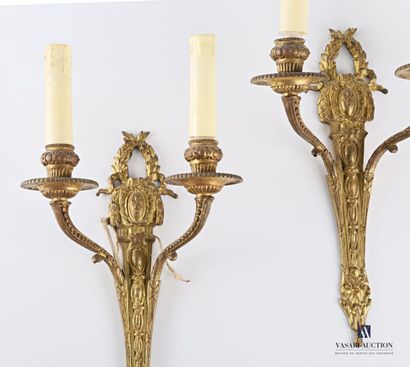 null Pair of gilt bronze two-light sconces, the shaft has a frieze of tapering mandorles...