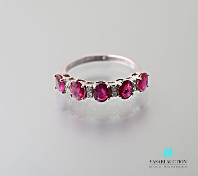 null 750 thousandths white gold ring set with five oval-cut rubies interspersed with...