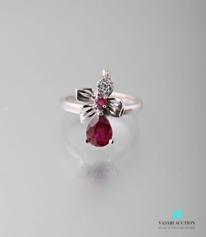 null 925 sterling silver ring set with a treated pear cut ruby surmounted by a floral...