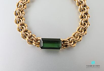 null 750 yellow gold double link bracelet, the center adorned with a green tourmaline...