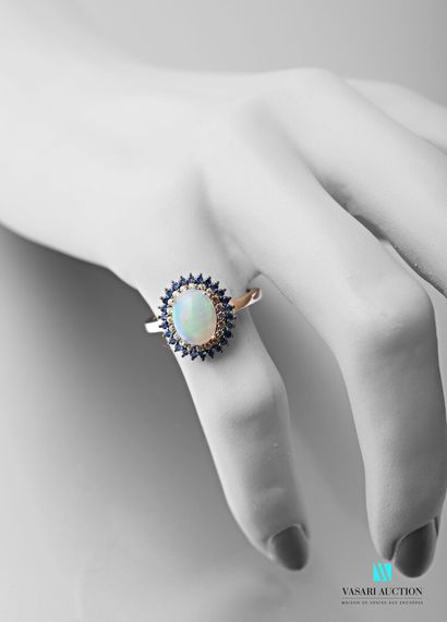 null 925 sterling silver ring set with an opal surrounded by two rows of yellow and...