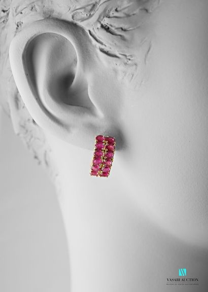null Pair of gilt silver earrings with two lines of oval ruby treated, Belgian pushchair...