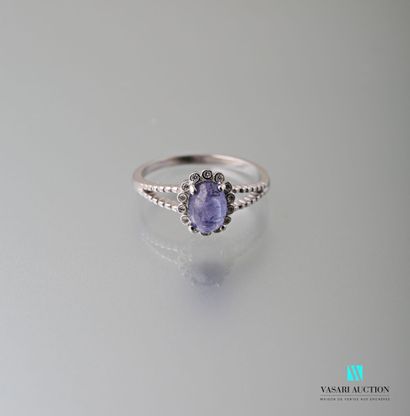 null 925 sterling silver ring set with a tanzanite cabochon surrounded and shouldered...
