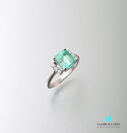 null 750 thousandths white gold ring set with a square-cut emerald calibrating approximately...