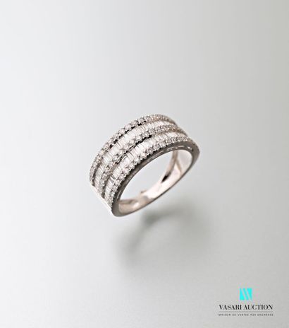 null 750 thousandths white gold ring set with three lines of modern cut diamonds...