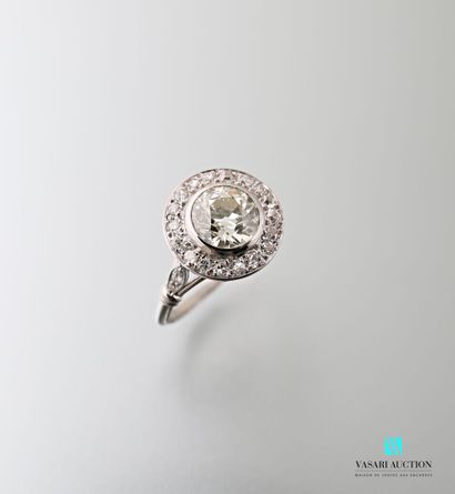 null 750 thousandths white gold ring set with a central antique cut diamond of approximately...