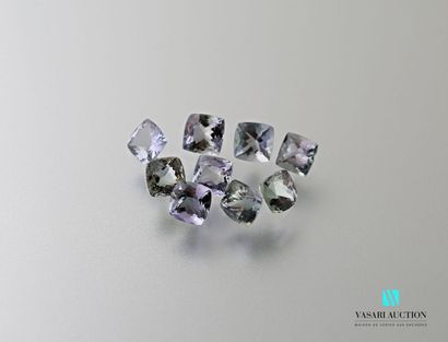 null Nine faceted square tanzanites on paper for a total weight of 8.63 carats.