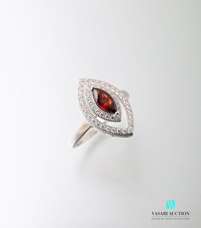 null 925 sterling silver ring set with a garnet surrounded by two rows of white stones...