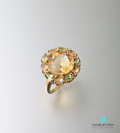 null Ring in vermeil centered of a citrine of round size hemmed with citrines and...