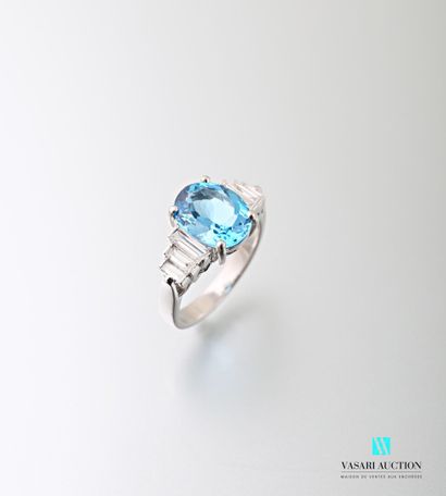 null 750 thousandths white gold ring set with an oval-shaped blue topaz of approximately...