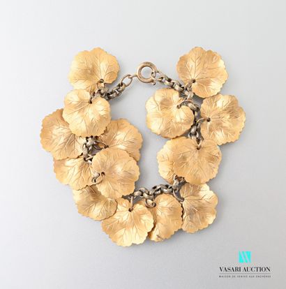 null Gold plated metal bracelet with mesh supporting fifteen charms simulating leaves....