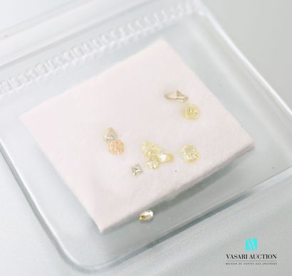 null Set of ten small diamonds of different shapes (ovals, pears, squares) 

on yellow,...
