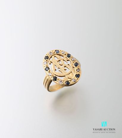 null Ring in 750 thousandths yellow gold, oval openwork motif with BC numerals surrounded...