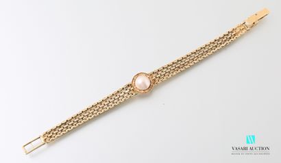null Supple bracelet in 750 thousandths yellow gold, alternating smooth and guilloché...