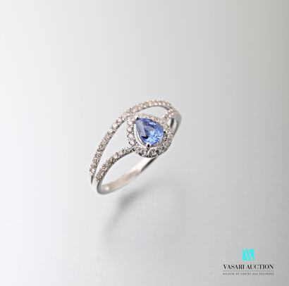 null 750 thousandths white gold openworked body ring set with a pear-cut sapphire...