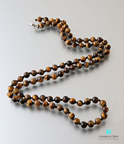 null Long necklace decorated with tiger eye beads, the clasp snap hook in metal

Length...