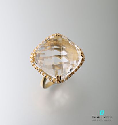 null Vermeil ring set with a faceted cushion cut rock crystal calibrating approximately...