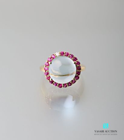 null Vermilion ring centered with a cabochon-cut light blue topaz in a round ruby...