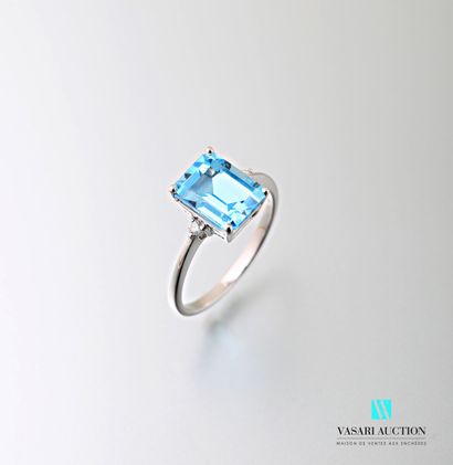 null 750 thousandths white gold ring set with an emerald-cut topaz of approximately...